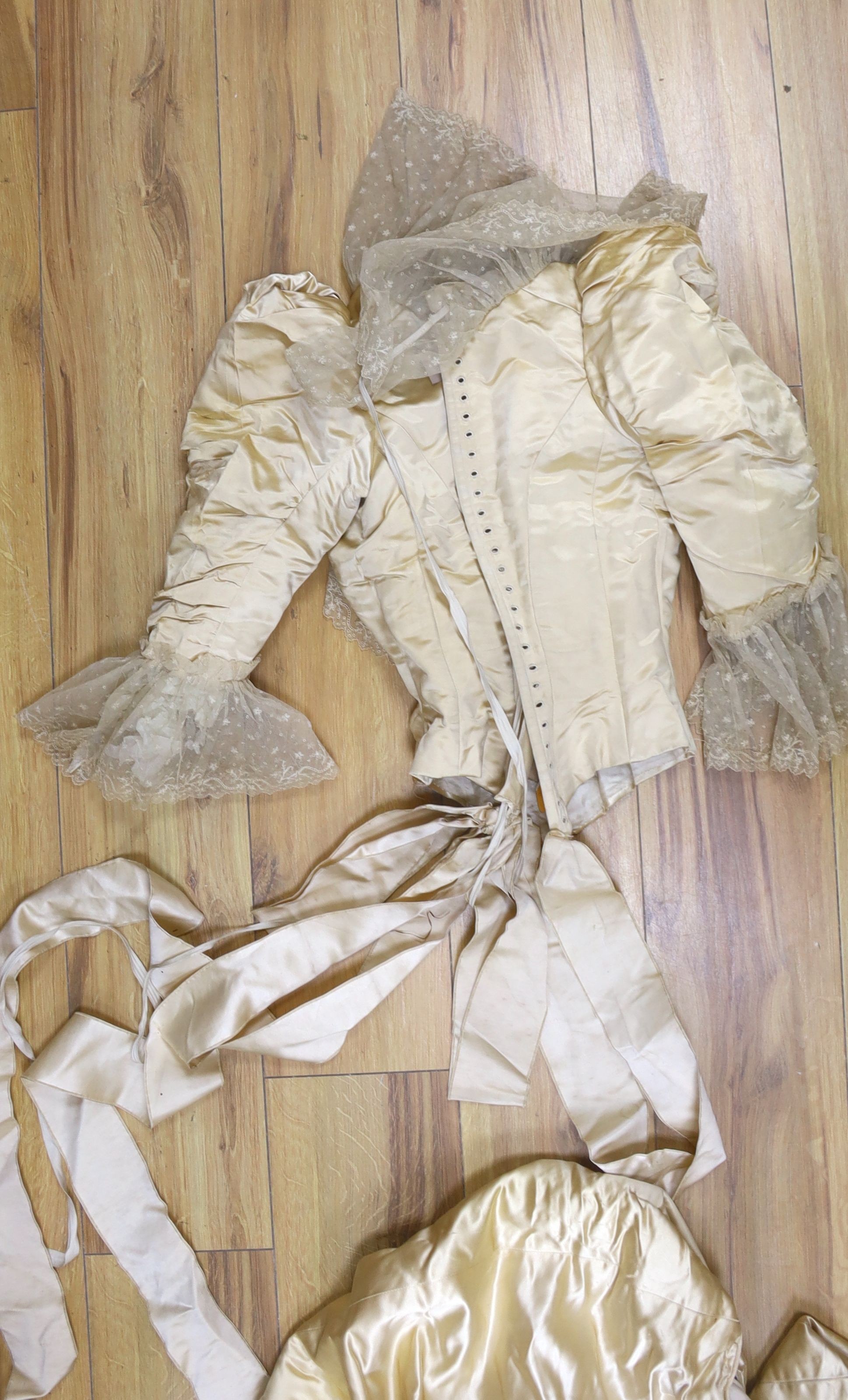 A Firth and Russell cream satin and lace wedding dress